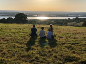 Friends Camping at Sunset